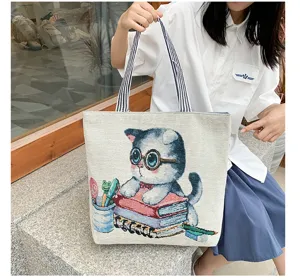 Cute canvas shoulder bag with cat pattern, large capacity shopping tote for daily use.
