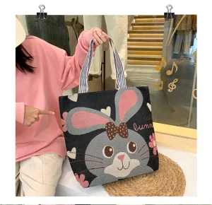 Borsa a tracolla in tela lavorata a maglia con delizioso motivo a coniglietto e spallacci.
