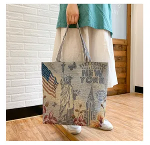 Detailed view of canvas tote bag featuring vintage New York City print and durable straps.