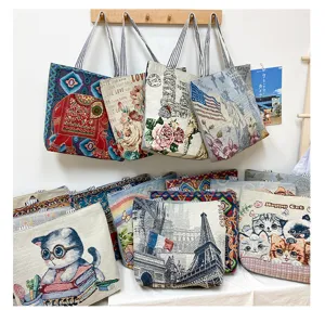 Detailed view of vintage tapestry canvas tote bags featuring diverse retro and cute cat print designs.