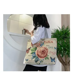 Vintage Blumen Leinen Tragetasche, stilvolle Schultertasche mit Schmetterlingsmotiv.
