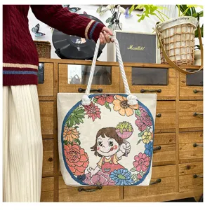 Modische Canvas-Tragetasche mit niedlichem gesticktem Mädchen und Blumenkranz-Motiv.