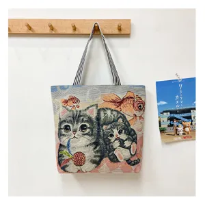 Woven canvas tote bag with cute cat and fish pattern, large capacity casual shoulder bag for daily use.
