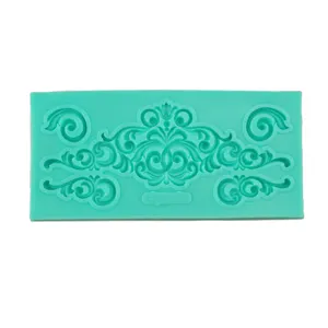 Silicone mold detail view, mint green baroque scroll fondant cake decorating tool.