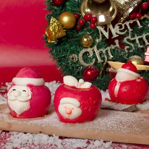Detailed view of Christmas Santa Claus and apple silicone molds for DIY baking and candles.
