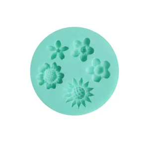 Detailed shot of mint green silicone flower mold, perfect for fondant and chocolate baking.