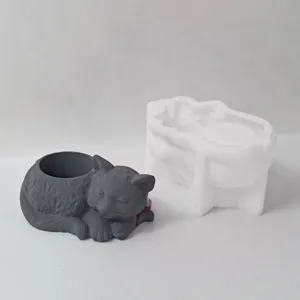 Detail view of sleeping cat silicone mold and grey finished container, clear texture and mold.