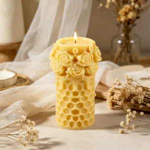 Handmade yellow beeswax pillar candle with honeycomb texture and elegant 3D rose flower design.