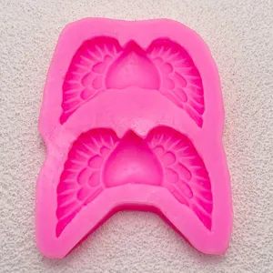 Close-up detail of the pink silicone heart wings baking mold, perfect for cake DIY decoration.