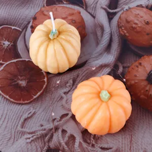 Pumpkin scented candle for Halloween home decoration, cute autumn aesthetic room wax decor.