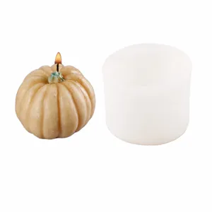 Detail shot of 3D pumpkin silicone mold with dimension markers and finished candle sample.