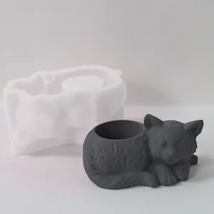 Detail shot showing the grey sleeping cat resin plaster pen holder craft and white silicone mold.