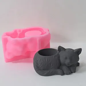 Silicone mold and finished sleeping cat pen holder for DIY concrete and resin crafts.