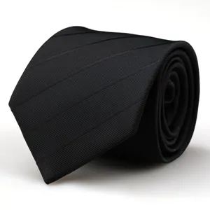Black necktie detail showing fine twill texture and neat rolled presentation for men suits.
