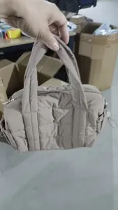 Puffer tote bag for women, stylish quilted handbag with top handles and zipper closure. Ideal.