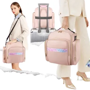 Pink travel cosmetic bag with multiple compartments, luggage strap, and shoulder strap.