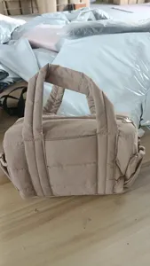 Puffer nylon handbag lightweight casual tote bag with top handle and secure zipper closure.