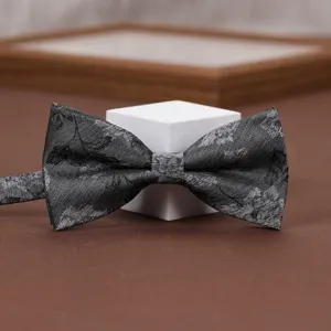 Classic grey patterned men's bow tie for formal suits, weddings, and stylish business events.