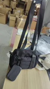 Black nylon 2-piece sports gym bag with detachable mini pouch and adjustable long straps.