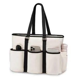 Detailed view of a white multi-pocket tote bag with black handles and handy front compartments.