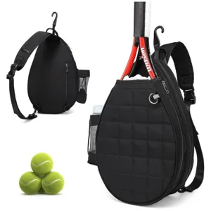 Black quilted tennis sling bag detail view, showing racket storage compartment and mesh pocket.