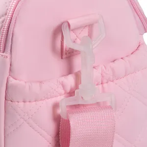 Pink quilted lunch bag strap and plastic clasp detail showing durable construction and stitching