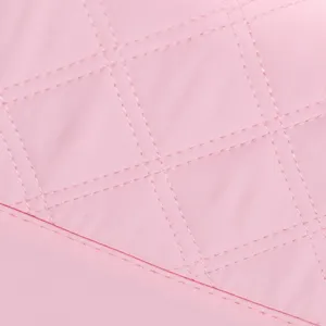 Pink quilted lunch bag detail, soft tasslon waterproof fabric with diamond stitching.