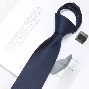 Close-up detail of the elegant dark blue zipper necktie, showing fine diagonal texture and neat knot.