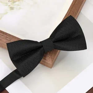 Black men's herringbone bow tie detail shot, perfect for formal business events and weddings.