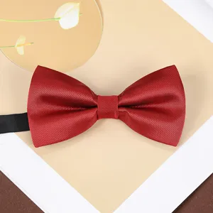 Burgundy bow tie detail view, classic twill fabric texture, elegant suit accessory.