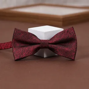 Burgundy textured bow tie for wedding suit groom detail view closeup product display