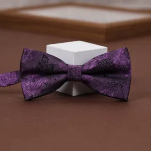 Purple floral bow tie for men and women, elegant design for weddings and formal parties.