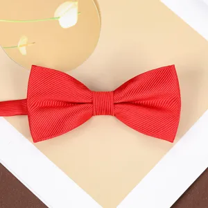 Classic red bow tie with ribbed texture for men's wedding suits and formal evening wear.