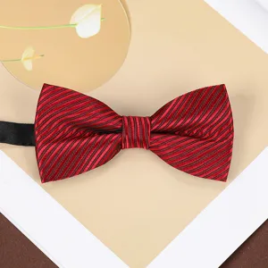 Closeup of a stylish red and black striped bow tie, perfect for wedding suits and formal wear.