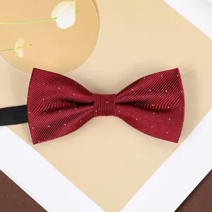 Burgundy bow tie featuring delicate white dot patterns, perfect for wedding groom and formal suits.
