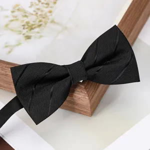 Detail shot of a classic black bow tie for men, stylish accessory for formal events.