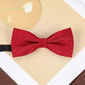 Classic red bow tie detail shot, perfect for weddings, groomsmen, and formal business suits.