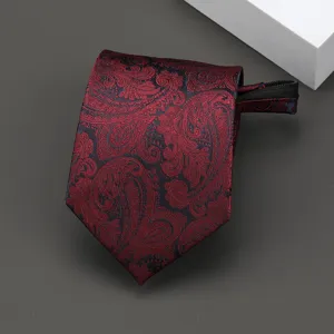 Detail shot of a dark red paisley jacquard zipper necktie, elegant formal wear accessory.