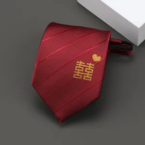 Red silk wedding necktie detail showing golden double happiness embroidery and zipper design.