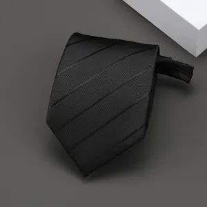 Detailed view of a stylish black striped zipper necktie, ideal for formal business wear.