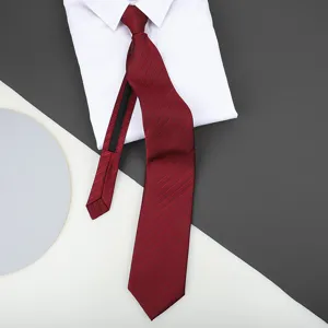 Red striped zipper necktie detail showcasing fabric texture with white shirt on background