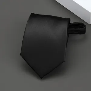 Detailed view of a sleek black zipper tie, perfect for formal business and wedding attire.