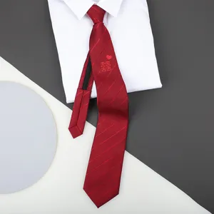 Red zipper tie detail shot displaying classic striped pattern and elegant double happiness embroidery.