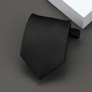 Close-up view of black striped zipper tie detail, featuring fine fabric texture and neat design.