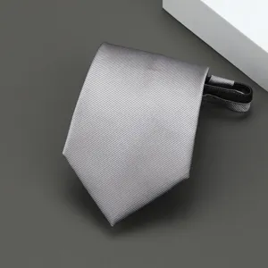 Detailed view of a grey striped zipper necktie, pre-tied narrow business tie for formal wear.