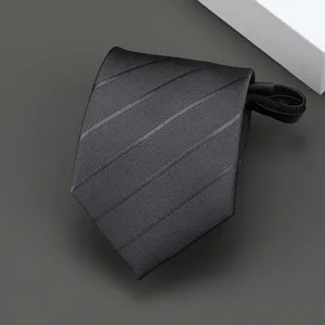 Detailed shot of black striped zipper tie, textured fabric close-up, convenient lazy necktie.