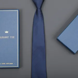 Detailed view of elegant navy blue striped tie with matching luxury gift box for men business.