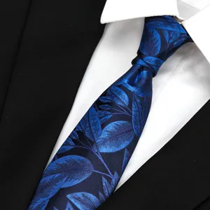 Close-up of blue leaf patterned men business tie detail texture and knot styling.