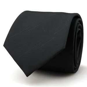 Close-up of black men's business suit necktie with subtle diagonal stripe texture detail.