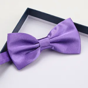 Purple satin bow tie detail close-up showcasing smooth texture and elegant formal style for men